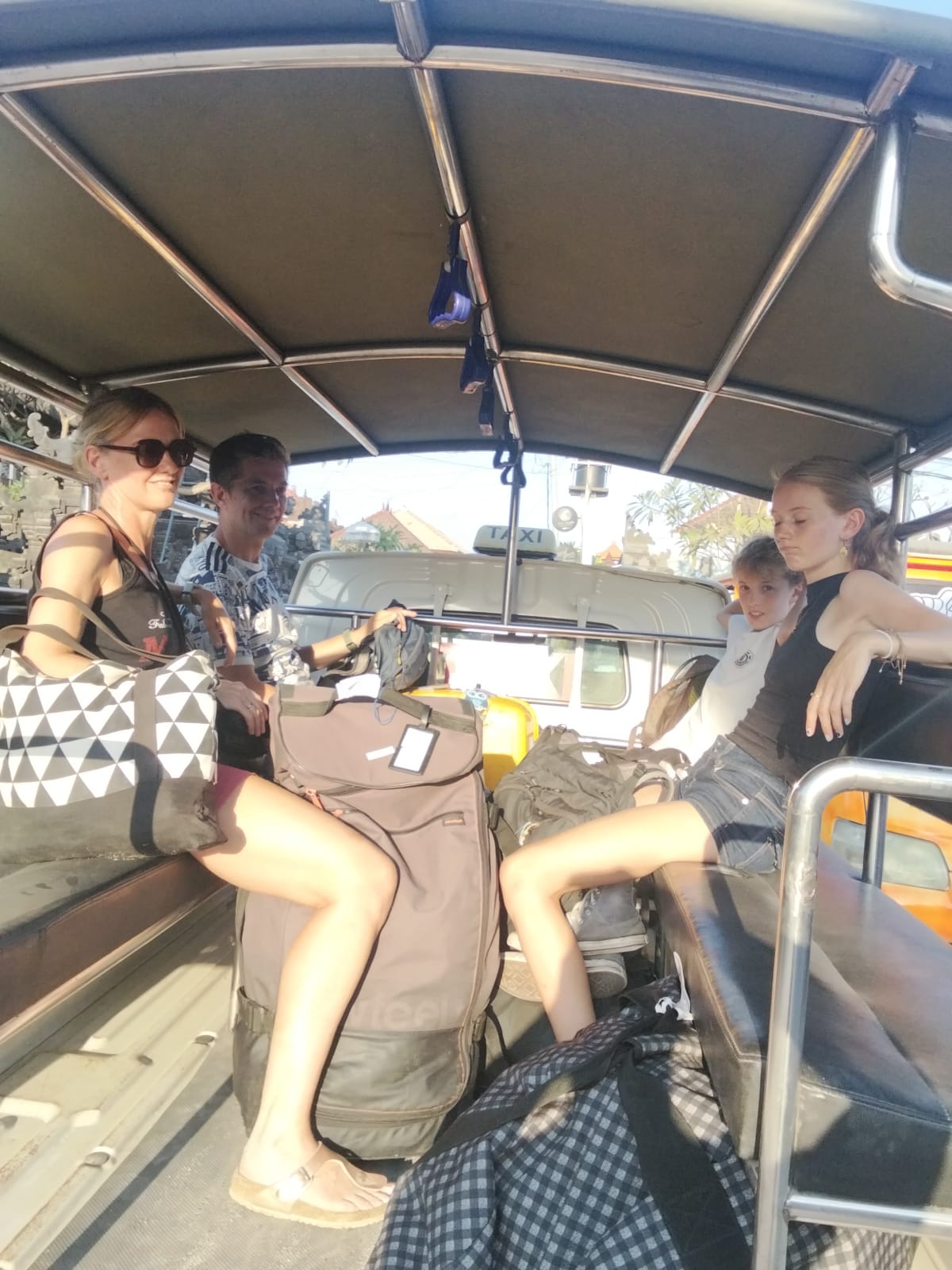 Guests enjoying a ride with AneX Taxi